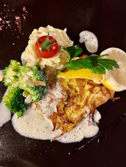 Salmon with mashed potatoes and broccoli