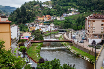Cangas de Narcea and river cityscape. Touristic village in Asturias, Spain - obrazy, fototapety, plakaty