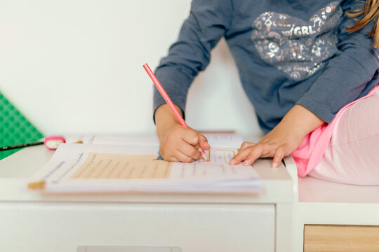 Anonymous girl doing homework