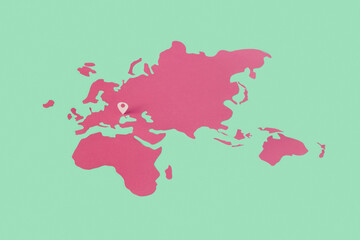 Location pin on Ukraine over pink paper map.