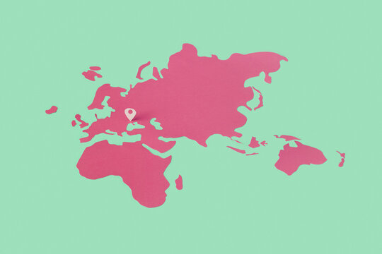 Location pin on Ukraine over pink paper map.