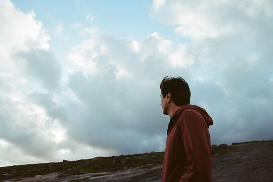 A man over cloudy sky