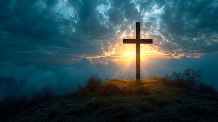   A cross atop a hill, sun shining through scattered clouds above