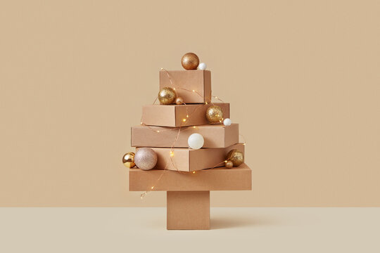 Christmas tree made of recyclable cardboard boxes, balls and garlands