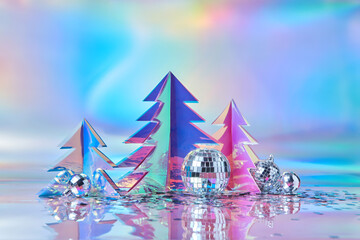 Christmas trees of holographic plastic decorated with disco balls