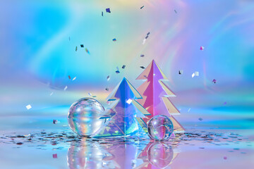 Christmas trees made of holographic foil under falling confetti