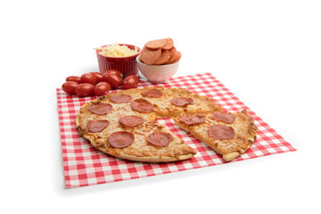 a slice cut out of a pepperoni pizza on a red checked background isolated on white