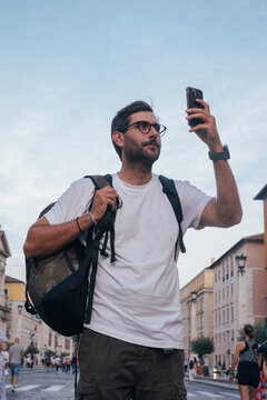 Handsome Young Backpacker Taking a Picture in Rome