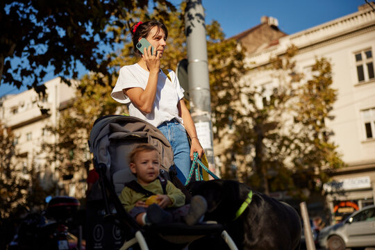 Portrait of a mother talks on the phone