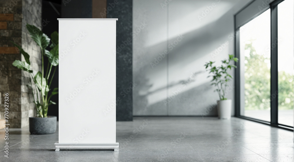 Wall mural white roll-up banner template standing in lobby next to windows. blank advertisement mockup in busin