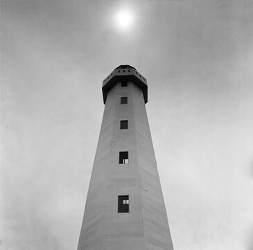 A Majestic Lighthouse Under a Midday Sun