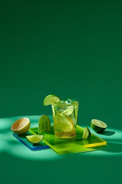 Healthy food background: cucmber and lime detox soda water