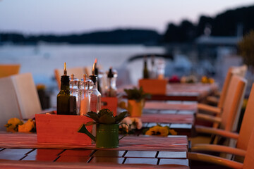 Romantic sunset beach - Beautiful cafe on the beach of Adriatic sea coast Croatia in historic city Rovinj Croatia Istria - obrazy, fototapety, plakaty