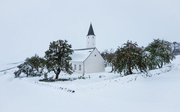 Church in a white snow covered landscape, Holar Iceland