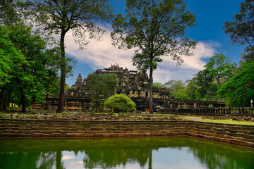 Baphuon Temple with its sacred pool - 11th century Shiva temple built by Suryavarman I, built in classic Khmer temple mountain style at Siem Reap, Cambodia, Asia