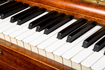 a close up angle view of a rosewood piano keyboard
