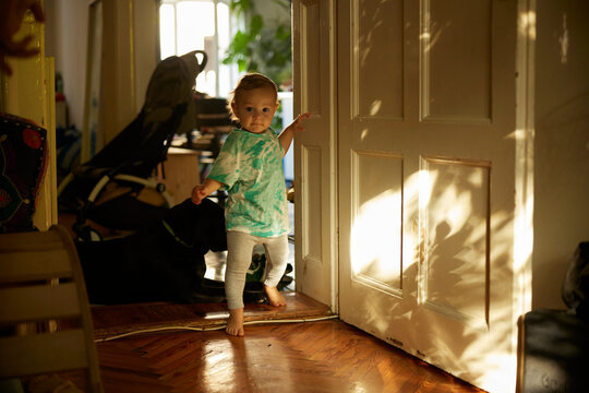 Portrait of a boy walking through the house