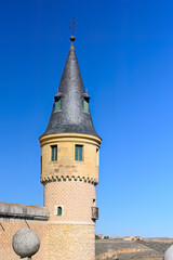 Fototapeta na wymiar Ancient tower in blue sky, Segovia, Spain