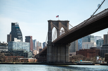 Brooklyn Bridge with Manhattan skyline backdrop.