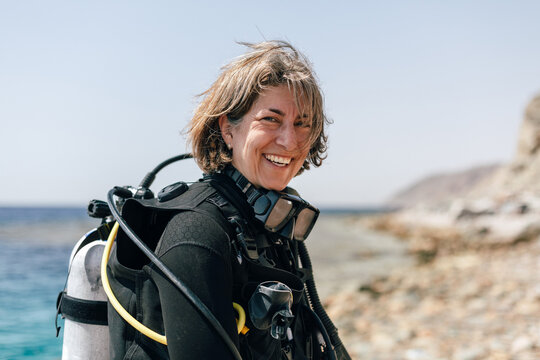 Beautiful Scuba Diver woman smiling