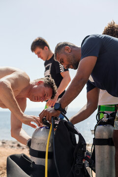 Man learning scuba diving techniques in a course