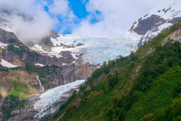 White glacier between green mountain range at the  Ventisquero Yelcho trail, Corcovado National Park, Chile