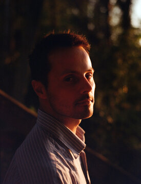Man on sunset by the river