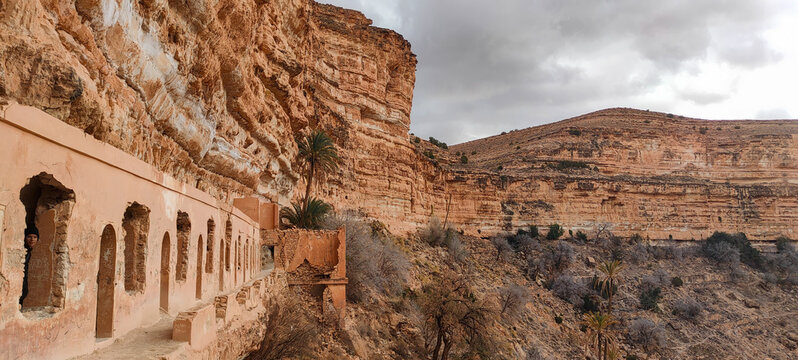 The balconies of Ghoufi, ancient Berber village, with stone and clay houses, carved into waterfalls in the rock, and the river which waters the oasis of palm trees and fruit trees. Batna. Algeria