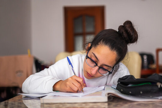 teenager studying at home
