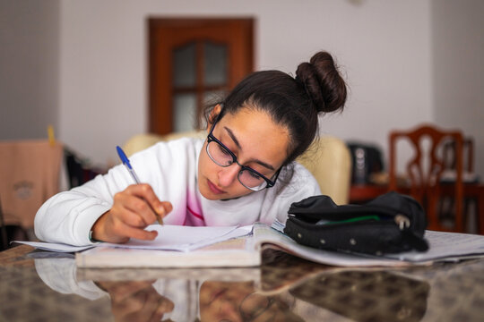 teenager studying at home