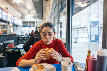Woman at a breakfast spot