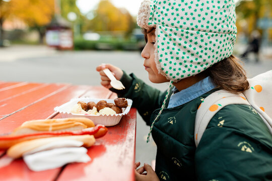kid eating Swedish meatballs 