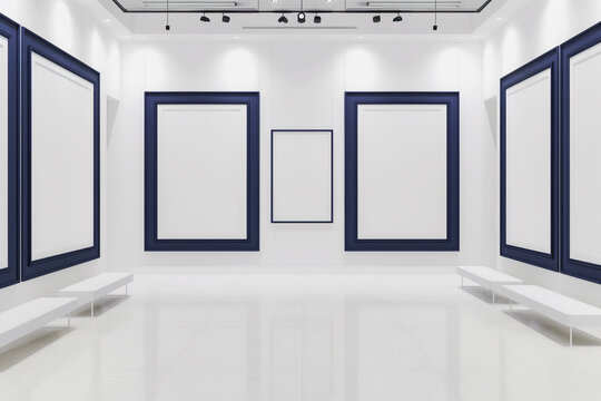 A white art gallery with a sophisticated ambiance, featuring empty blank mock-up posters in frames of a rich, navy blue. 
