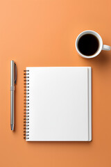 Top views workplace with a cap of coffee, pen, notebook, wood table orange  background