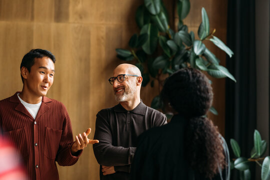 Colleagues standing in cafe