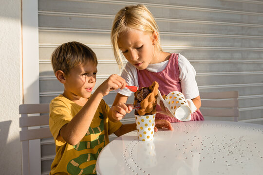 Kids and ice cream in waffle