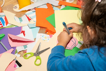 Messy craft kid. Little girl doing art crafts 