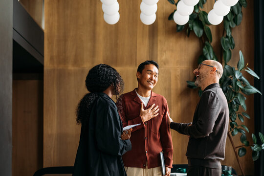 Colleagues standing in cafe