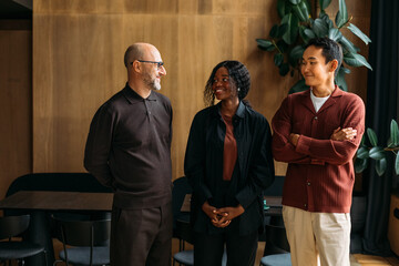 Colleagues standing in cafe