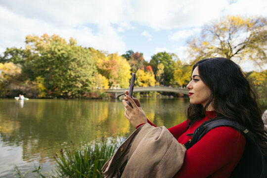 Woman taking photos in Central Park