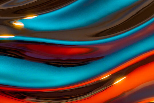 Fototapeta Abstraction of beautiful waves of multicolored metallic liquid