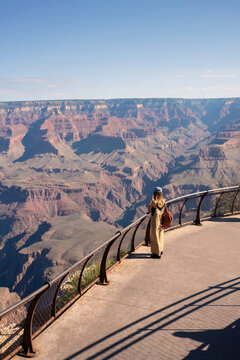 A tourist admires the mighty Colorado Canyon in California