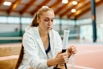 A woman with a tennis racket