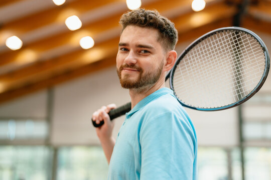Portrait of a man with a tennis racket