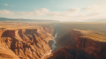 A drone shot of a beautiful canyon scene with the sunlight creating shadows and contrasts on the rocks
