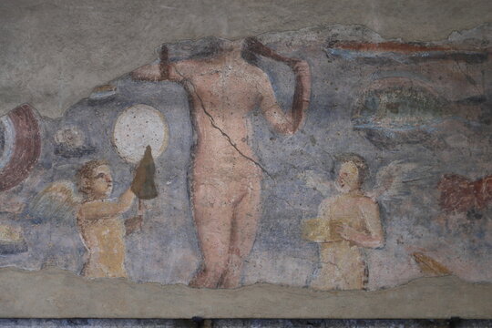 Old roman fresco with Eros in Ostia Antica