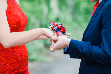 hands of the person with a flower