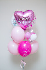 a set of pink balloons for a girl, the inscription 