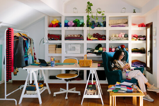 Knitting workroom with an artist crocheting
