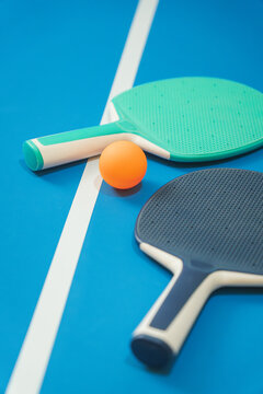 Two rackets and one ping pong ball